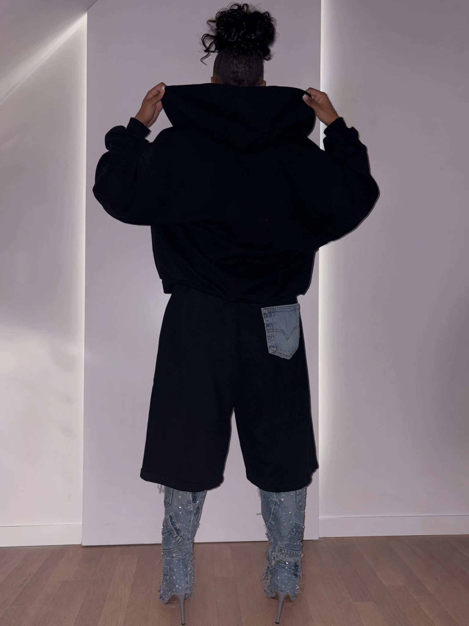 The reverse of the asymmetric jacket and shorts.
