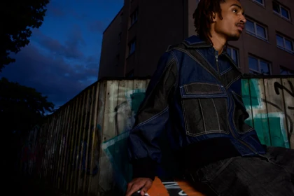 A closer view of the denim jacket and its contrasting panels.