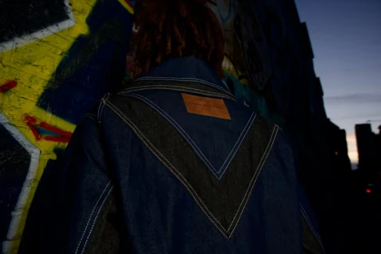 A close study of the jacket’s denim panels and leather label.